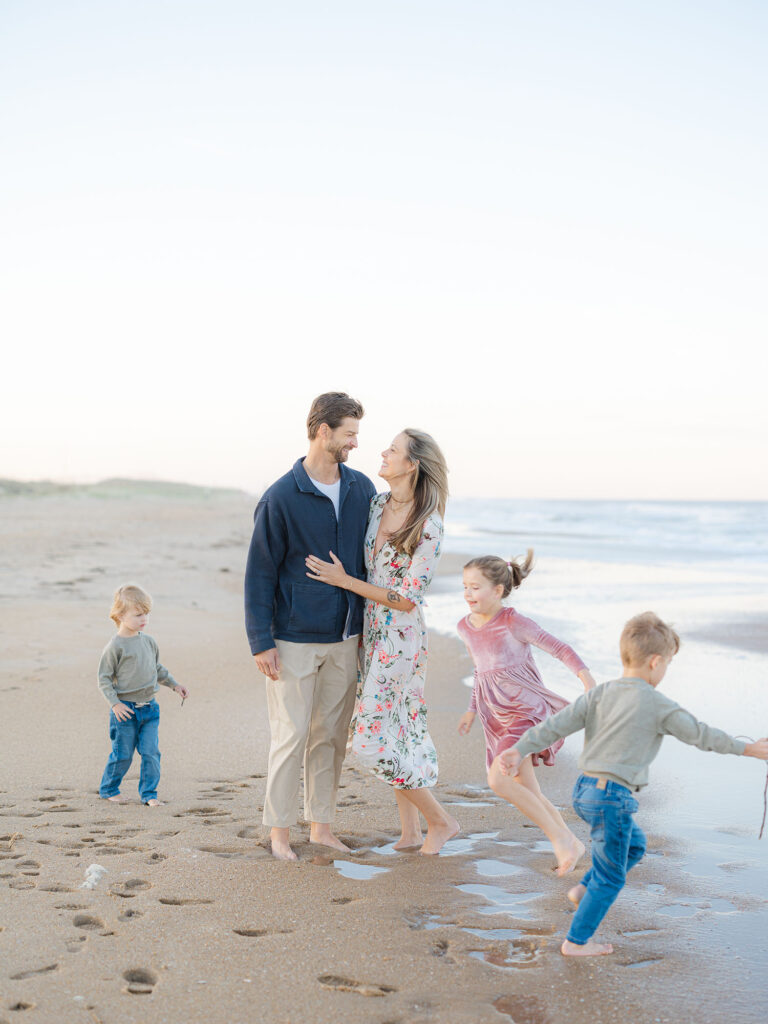 Family of five playing at the north end beach by Norfolk family photographer Ashley Brickner 