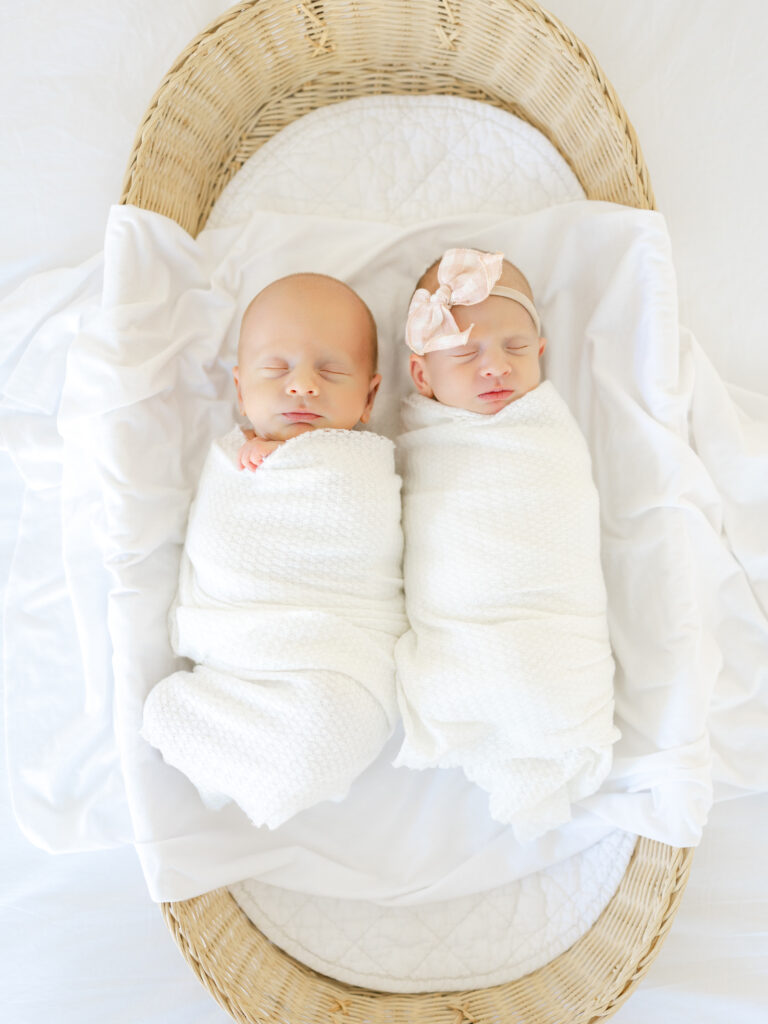 Twin babies in swaddled white blankets for Hampton Roads newborn photography session by Ashley Brickner 