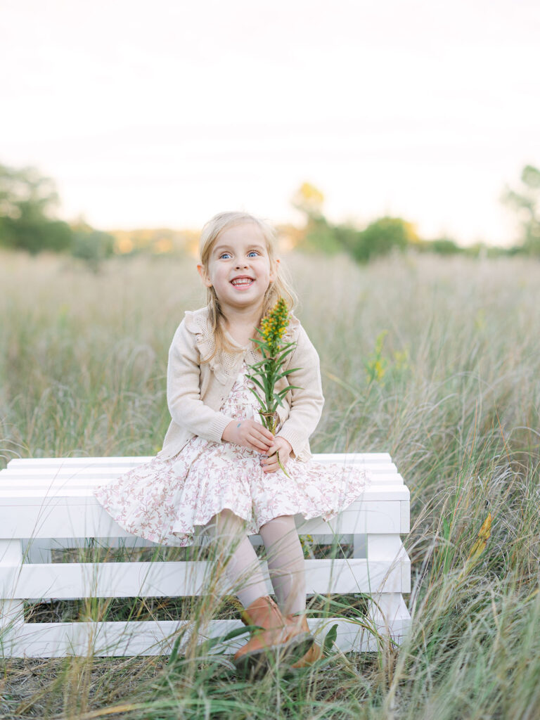 Toddler girl dressed in neutral floral dress by Hampton Roads Family Photographer Ashley Brickner 