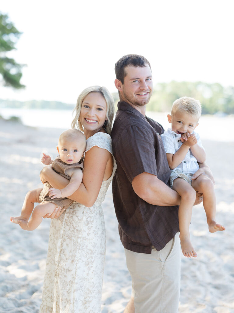 Mom dad and toddler boys dressed in neutrals and browns by Virginia family photographer Ashley Brickner 