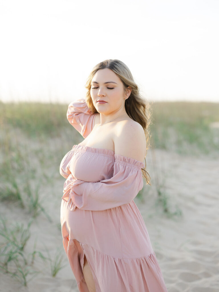 Pregnant mom standing on North End beach by Ashley Brickner 