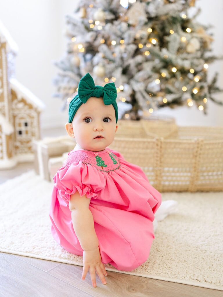 Baby girl in pink photographed for santa mini session by Virginia Beach family photographer Ashley Brickner 